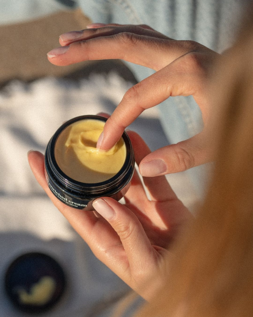 Vitamin Enriched Cream and lady using it 